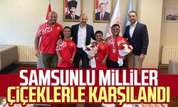 Samsunlu milliler havalimanında çiçeklerle karşılandı