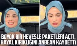 Büyük bir hevesle paketleri açtı, hayal kırıklığını kaydetti