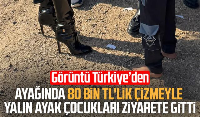 Ayağında 80 bin TL'lik çizmeyle yalın ayak çocukları ziyarete gitti